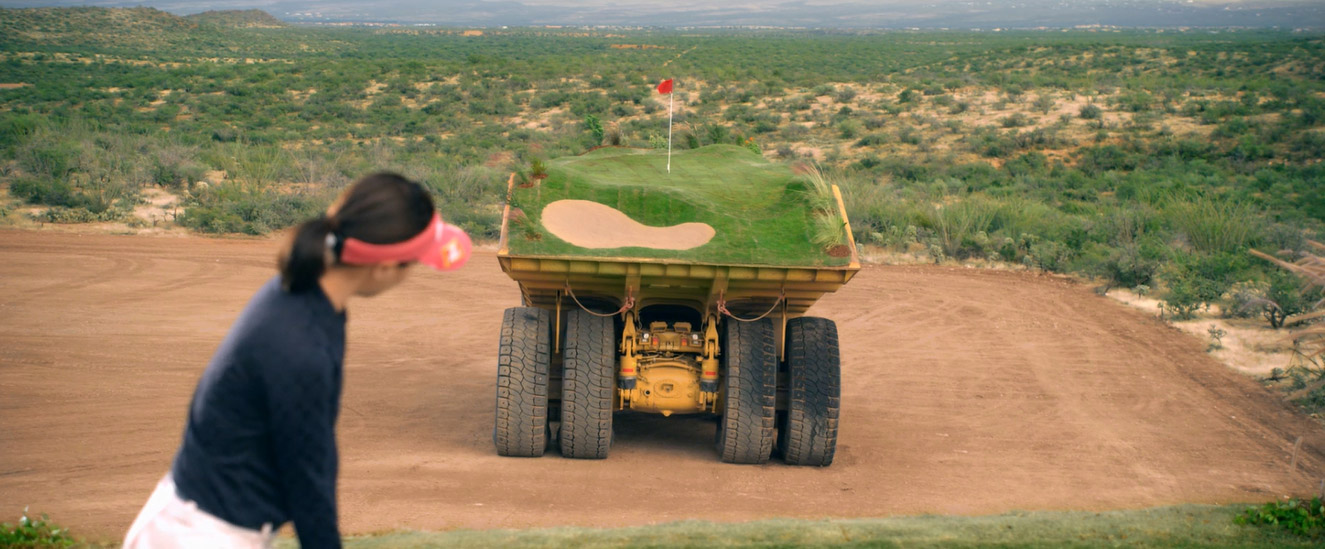 Watch 2 Pro Golfers Play a Makeshift, Moving Golf Course on the Back of 5 Caterpillar Machines