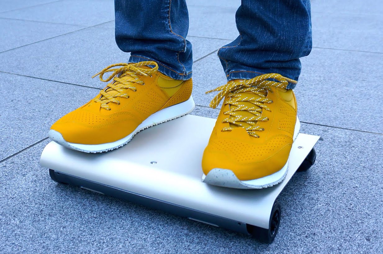 The WalkCar is a Small, Laptop-Like Transportation Device You Can Roll Around Town On