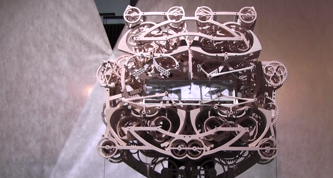 Mechanical Clock Has 400 Wood Components and 4 Arms That Write Out the Time Every Minute