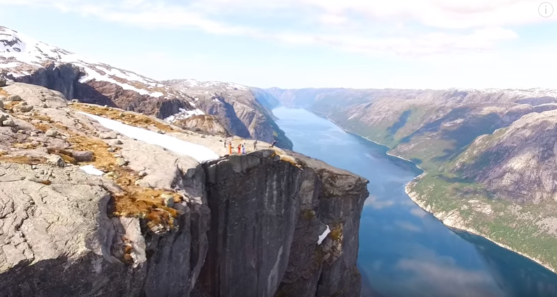 Watch These Crazy People BASE Jump Off a 3,228-Foot Cliff in Norway