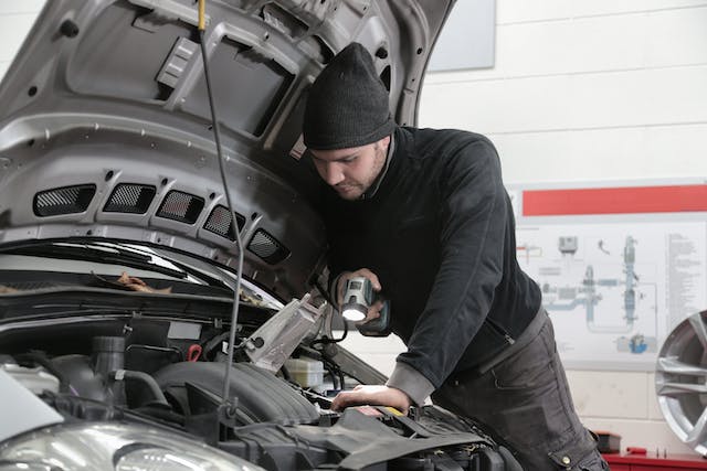 https://www.pexels.com/photo/man-in-black-jacket-and-black-knit-cap-inspecting-car-engine-3807277/